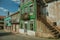 Old houses with worn facade and staircase