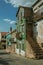 Old houses with worn facade and staircase