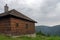 Old hunting wooden cottage in Jeseniky mountains on a  summer cloudy day