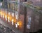 Old industrial buildings reflected in the canal in chester at twilight with illuminated windows