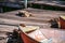 Old iron frayed and shabby boat noses tied to wooden dock and cat