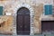 Old iron gate in a medieval house, Piazza del Conte, Siena, Italy