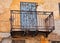 Old Iron Lace Balcony on Faded Stucco House, Greece