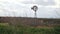 Old iron windpump windmill spinning in nature