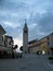 Old Istrian town of Novigrad, Croatia. A beautiful church with a high elegant bell tower, stone alleys and old Mediterranean house