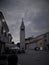 Old Istrian town of Novigrad, Croatia. A beautiful church with a high elegant bell tower, stone alleys and old Mediterranean house