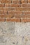 Old italian brick and bright stone wall after an architectural r