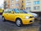 Old Japanese compact car yellow Nissan Micra parked