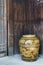 Old Japanese glazed earthenware or ceramic jar with dragon pattern design used as water container