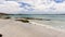 Old jetty on the sandy beach in Kangaroo Island coastline, South Australia