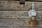 Old kerosene lamp hanging on a rustic wooden wall of a barn