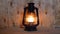 Old kerosene oil lamp burning. Wooden wall behind