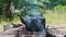 Old Kettle Standing on a Tourist Campfire in Nature