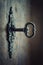 Old key in keyhole, macro shot. Gothic style. Key to knowledge. Concept and Idea for History, education, business, security,