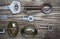 old keys and keyholes on aged wooden boards