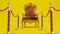 old king armchair with golden barrieres on yellow background, king throne