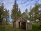 An Old Kirk, Bothy or Meeting Place Building in a remote valley in the Angus Glens set within a Forest Glade on a fine Morning.