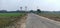 Old lady carry wood for cooking through main road in madhubani bihar india