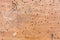 Old laminate Board with drill holes, paint and scuffs. Wooden old grunge background. Texture of dirty vintage laminate