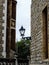 Old lamp hanging between ancient brick palace building in Great