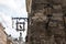 Old Lamp post and caffe sign vintage stone wall in lviv