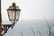 Old lamp post by the sea port of Manarola shore, Cinque Terre, Italy