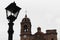 Old lantern with broken crystal and church, Guanajuato, Mexico