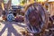 Old Large Wooden Wheel In Salvage Yard