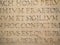 Old Latin text engraved on stone