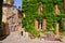 Old leafy buildings in a village in Provence, France