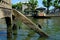 Old Left Broken Concrete Pier with Canal Background