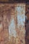 Old light blue painted grey rusty rustic rust iron metal frame background texture, vertical aged damaged weathered scratched