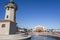 Old lighthouse and casino building in port of El Grao, maritime