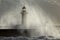 Old lighthouse covered with sea spray