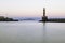 Old lighthouse in a quiet Harbor at sunset. Chania.