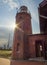 Old lighthouse of red brick at sunset in Klaipeda, Lithuania