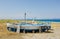 Old, little fishing ships are standing at the ground next to the sea in Sicily, Italy