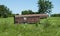 Old livestock trailer for sale in a summer field