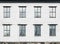 Old living house wall with windows, vintage facade