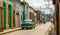 Old living houses across the road in the center of Santiago De Cuba, Cuba