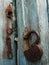 Old lock hanging on the wooden door