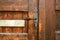 old lock in old wooden door in Riquewihr town