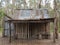 Old log cabin desolate in Australian forest