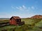 Old log cabin on marsh land