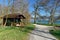 Old log house in Villette-park on the shore of lake Zug in spring. Town of Cham, canton of Zug, Switzerland.