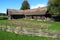 Old lone nostalgic house in village with a wooden fence