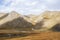 Old Lonely house of sheep or horse shepherd in beautiful autumn mountains of Kyrgyzstan. Aksai valley, Naryn region