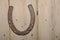 Old lucky horse shoe on wall
