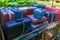 Old luggage cart filled with suitcases that are secured by a rope, Nostalgic baggage transportation