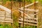 Old make shift retaining fence in rural farm field.